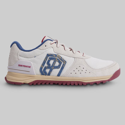 White sneaker with blue and red accents on a gray background