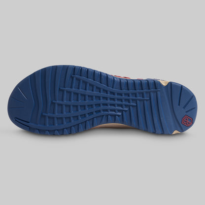 Blue sole of a shoe on a gray background