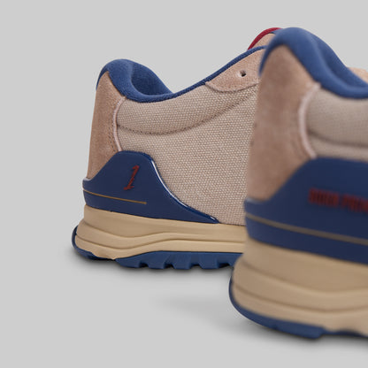 Beige and blue sneakers on a light gray background