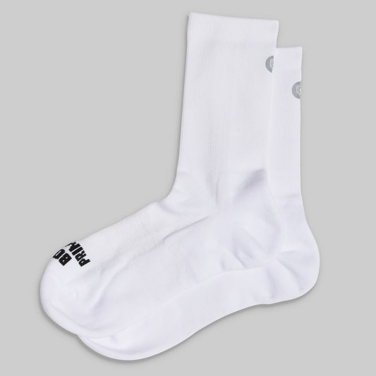 White socks with black logo on a gray background