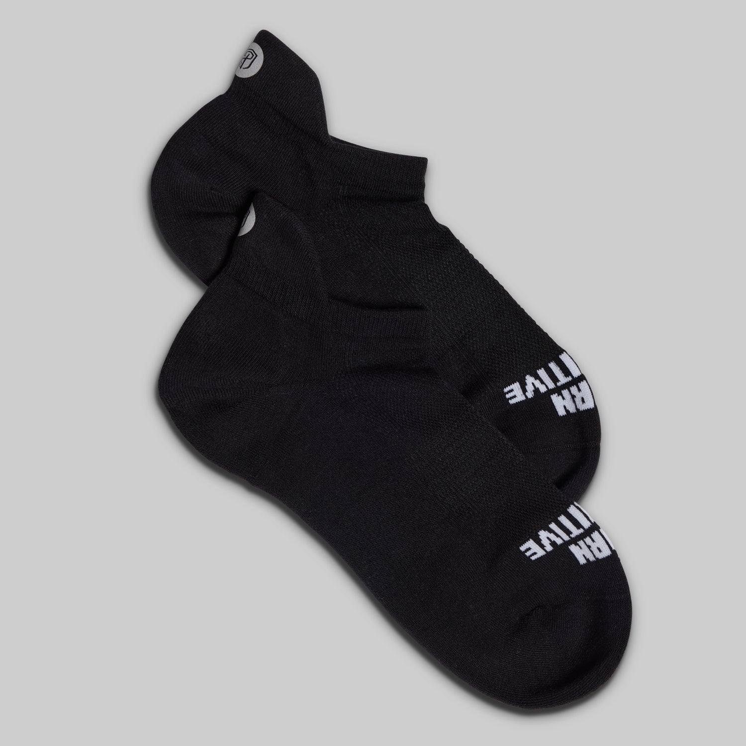 Black sock with white text on a gray background