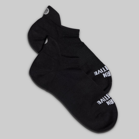 Black sock with white text on a gray background