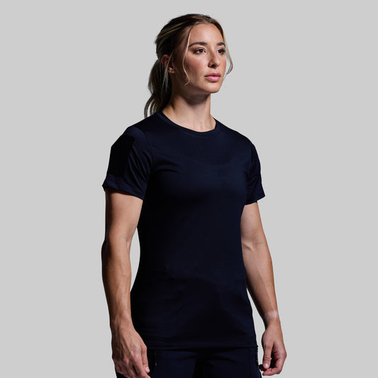 Woman wearing a blue t-shirt against a plain background