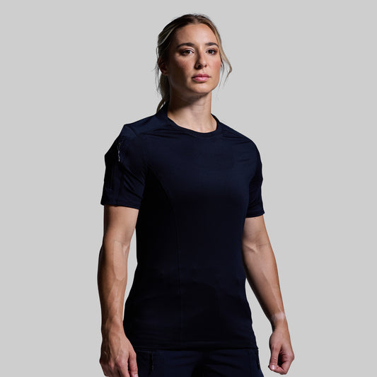 Person wearing a blue t-shirt against a plain background