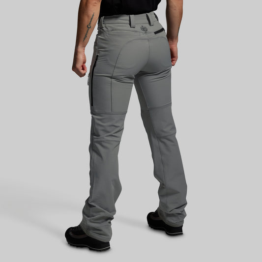 Gray pants worn by a person on a plain background