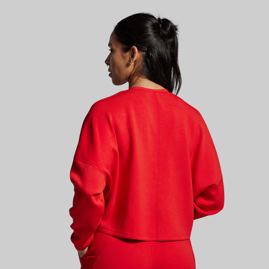Person wearing a red outfit on a gray background