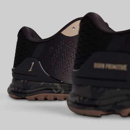 Black athletic shoes with brand name on a gray background