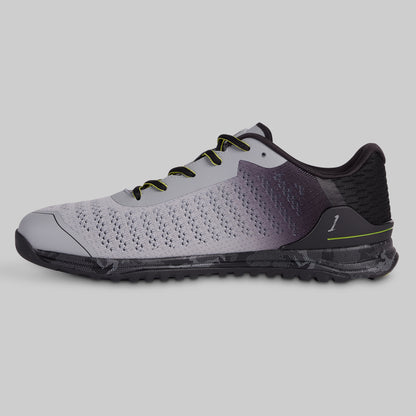 Gray and black athletic shoe on a light gray background