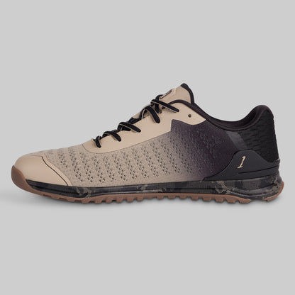 Beige and black sneaker on a gray background