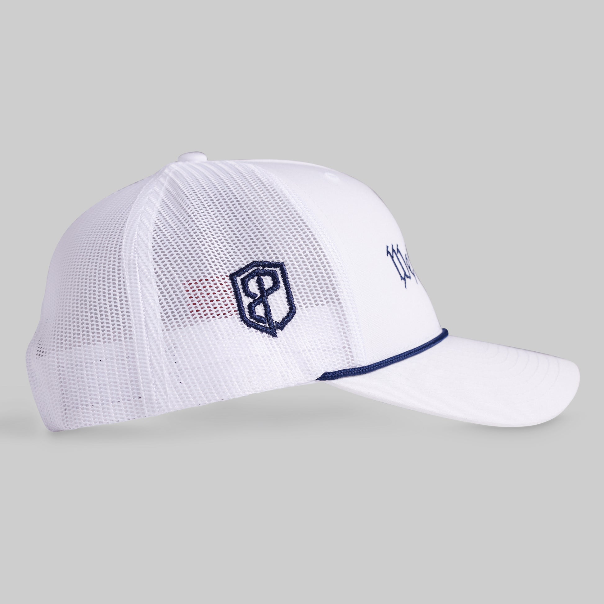 White mesh cap with navy logo on a gray background