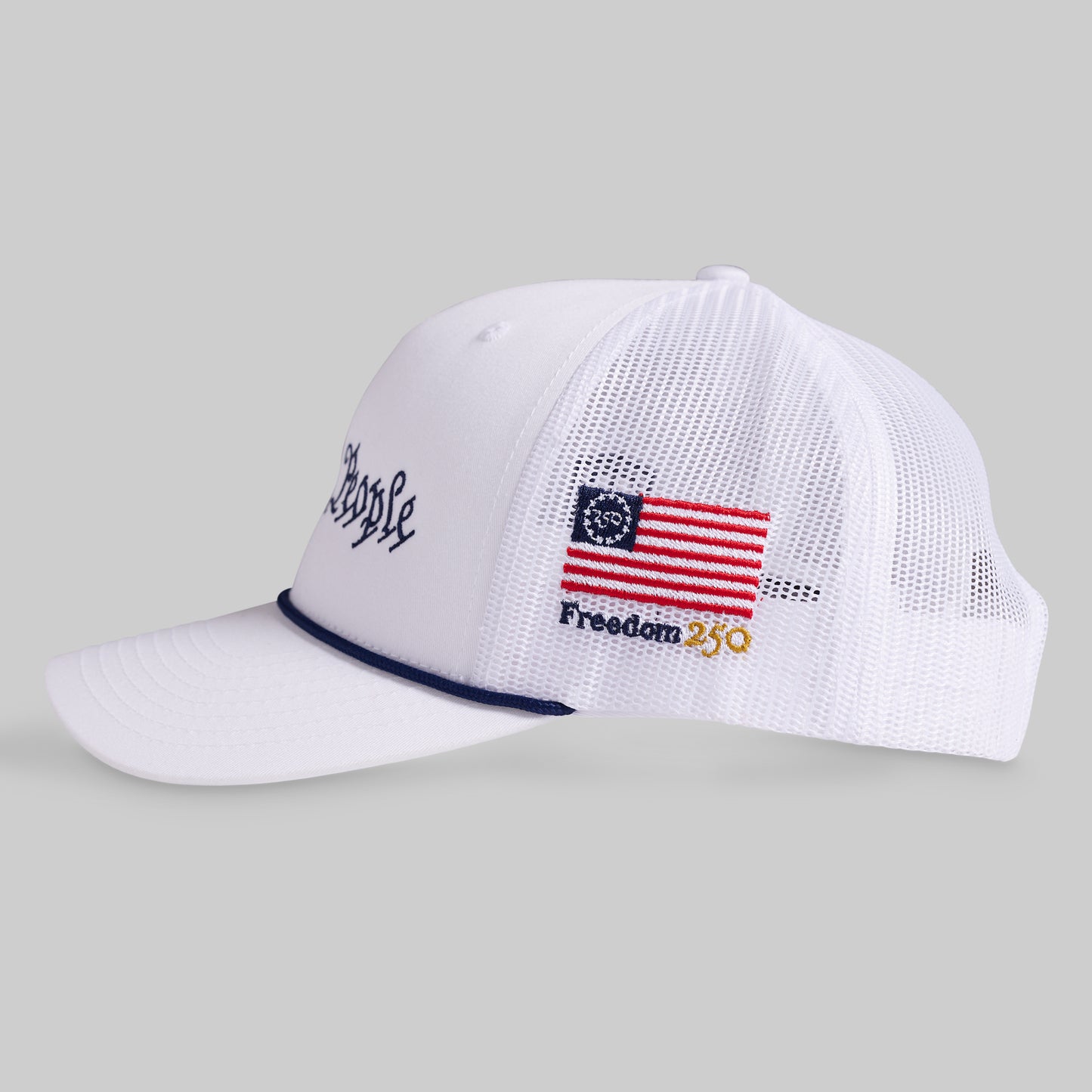 White cap with American flag design on a gray background