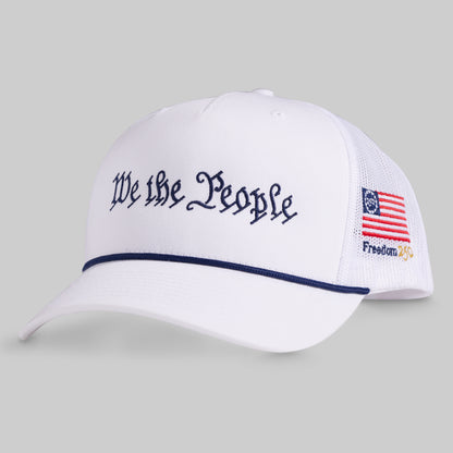 White cap with 'We the People' text and American flag design on a gray background