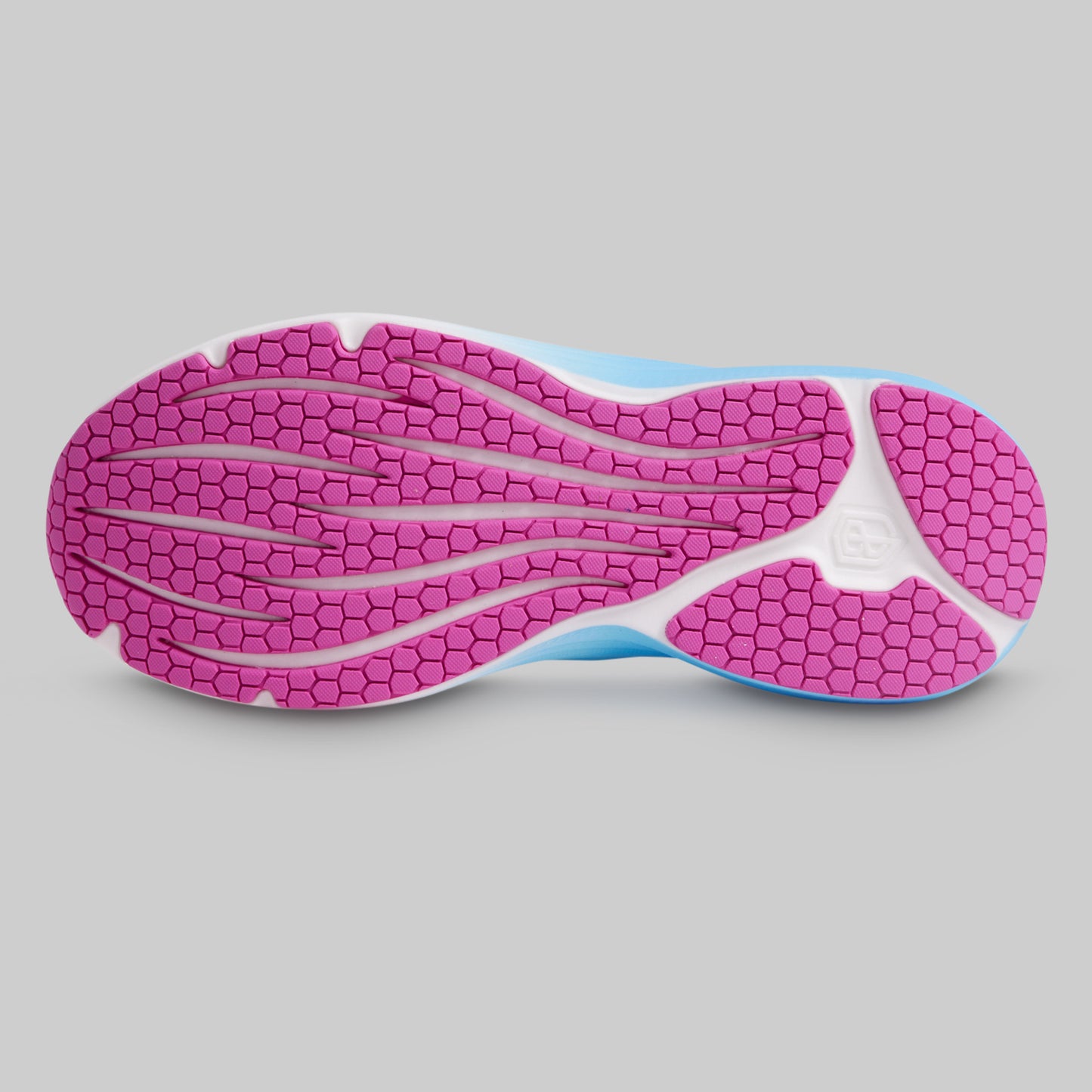 Close-up of a shoe sole with pink tread pattern on a gray background
