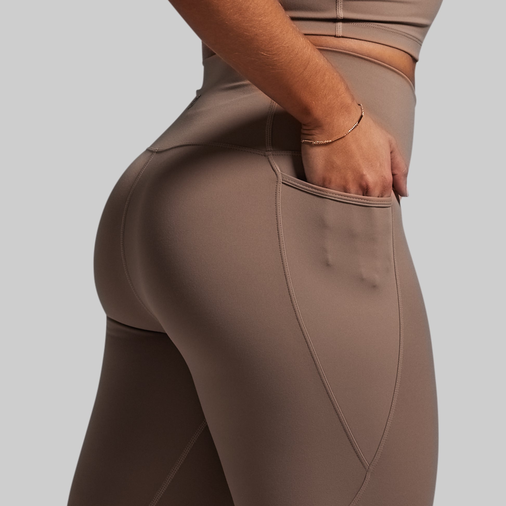 Brown leggings with a plain background