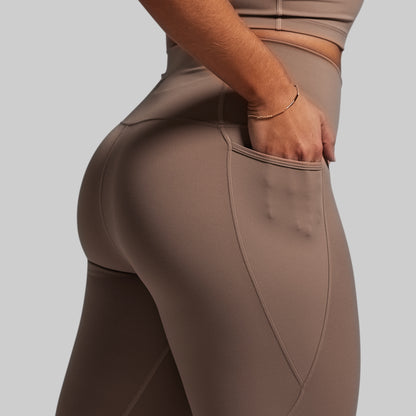 Brown leggings with a plain background